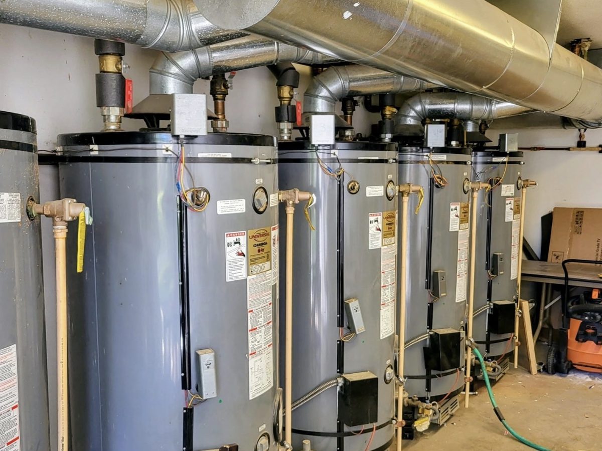 The original bank of commercial gas water heaters before replacement