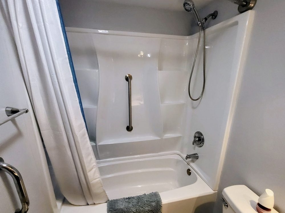 Remodeled bathroom in a mobile home with a new tub, surround and fixtures
